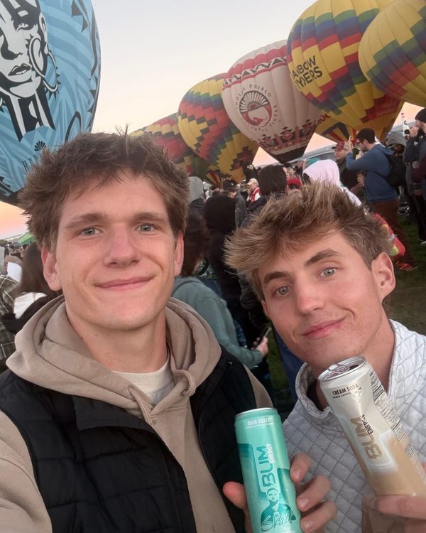 Eli and a friend with BUM Energy cans at the Balloon Fiesta
